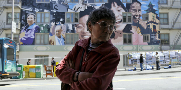 California Daily Life A woman walks past a colorful mural in San Francisco's Chinatown district, Thursday, May 30, 2013. (AP Photo/Marcio Jose Sanchez)